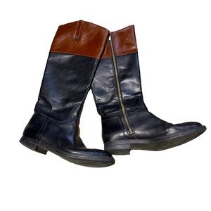 Black and brown Enzo Angiolini knee high riding boots.